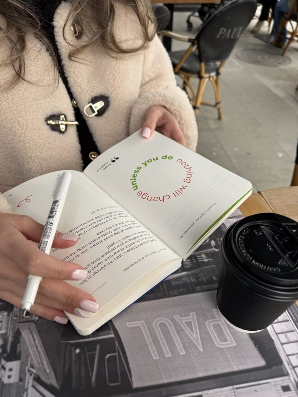 Reading the planner at a cafe